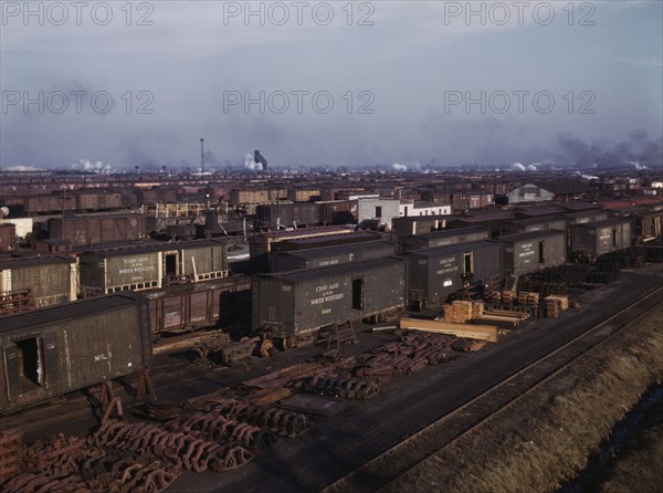 Freight cars being maneuvered in a Chicago and North Western railroad yard, Chicago, Ill., 1942. Creator: Jack Delano.