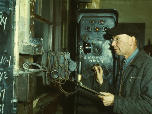 Hump master in a Chicago and North Western railroad yard operating a signal..., Chicago, Ill., 1942. Creator: Jack Delano.