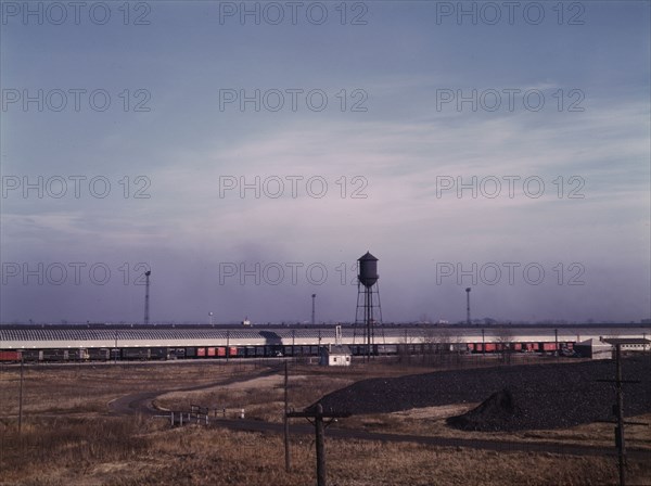 Truck trailers loading and unloading at C & NW RR's Proviso yard, Chicago, Ill., 1942. Creator: Jack Delano.