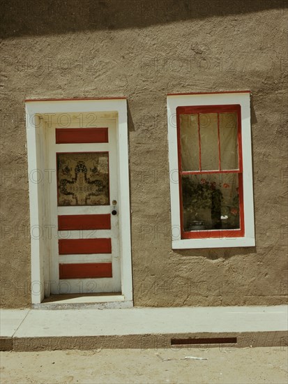 Door and window in a Spanish-American home, Costilla, New Mexico, 1940. Creator: Russell Lee.