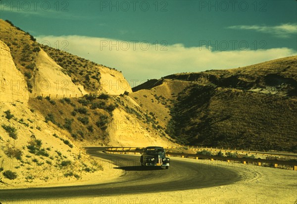 Road cut into the barren hills which lead into Emmett, Idaho, 1941. Creator: Russell Lee.