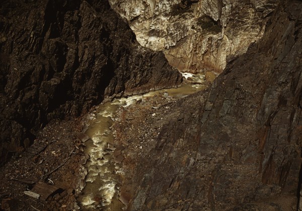 Rocks and stream along the Million Dollar Highway, Ouray County, Colorado, 1940. Creator: Russell Lee.