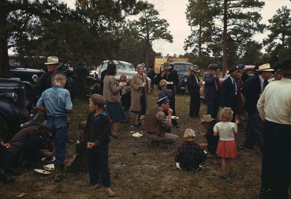 Crowd eating free barbeque dinner at the Pie Town, New Mexico Fair, 1940. Creator: Russell Lee.