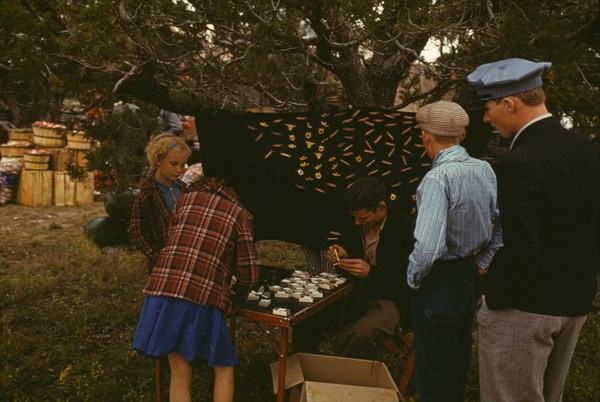 Initial pin souvenirs at the Pie Town, New Mexico Fair, 1940. Creator: Russell Lee.