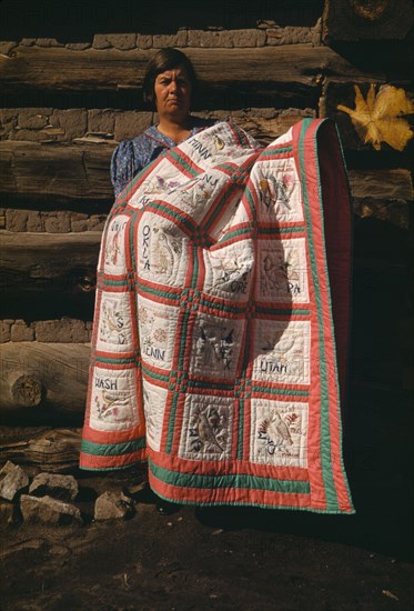 Mrs. Bill Stagg with state quilt which she made, Pie Town, New Mexico, 1940. Creator: Russell Lee.