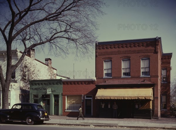 Laundry, barbershop and store, Washington, D.C.?, between 1941 and 1942. Creator: Louise Rosskam.