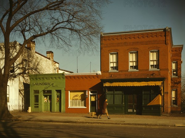 Laundry, barbershop and stores, Washington, D.C.?, between 1941 and 1942. Creator: Louise Rosskam.