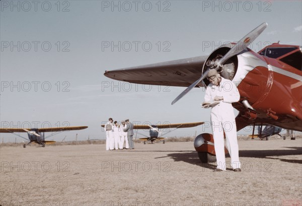 Civilian training school, students and instructors, Meacham Field, Fort Worth, Tex., 1942. Creator: Arthur Rothstein.