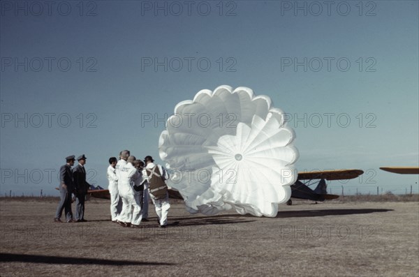 Instructor explaining the operation of a parachute to student pilots, Fort Worth, Tex., 1942. Creator: Arthur Rothstein.