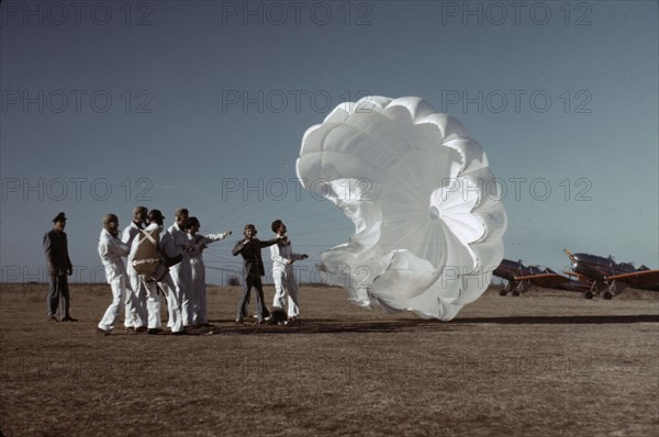 Instructor explaining the operation of a parachute to student pilots, Fort Worth, Tex., 1942. Creator: Arthur Rothstein.