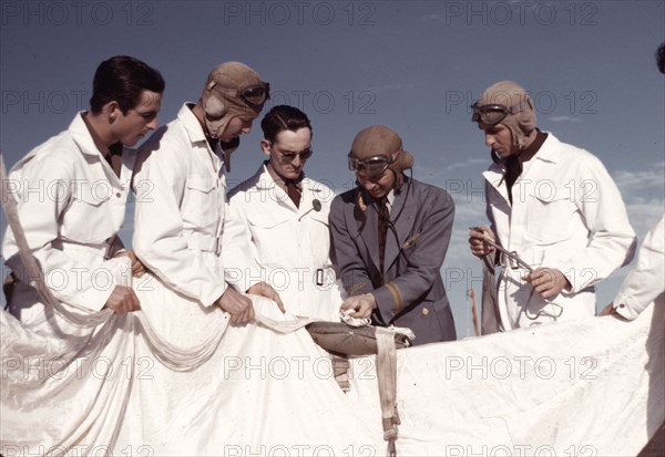 Instructor explaining the operation of a parachute to student pilots, Fort Worth, Tex., 1942. Creator: Arthur Rothstein.