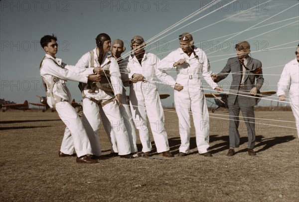 Instructor explaining the operation of the parachute to students, Fort Worth, Tex., 1942. Creator: Arthur Rothstein.