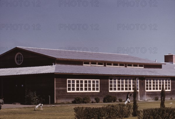 Boys flying a kite in front of the community center, FSA camp, Robstown, Tex., 1942. Creator: Arthur Rothstein.