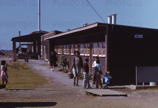 Gardens are planted in front of the row shelters, FSA ... labor camp, Robstown, Tex., 1942. Creator: Arthur Rothstein.