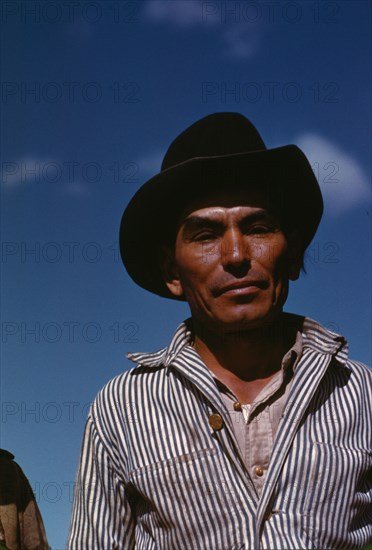 Migratory worker, FSA ... camp, Robstown, Tex., 1942. Creator: Arthur Rothstein.