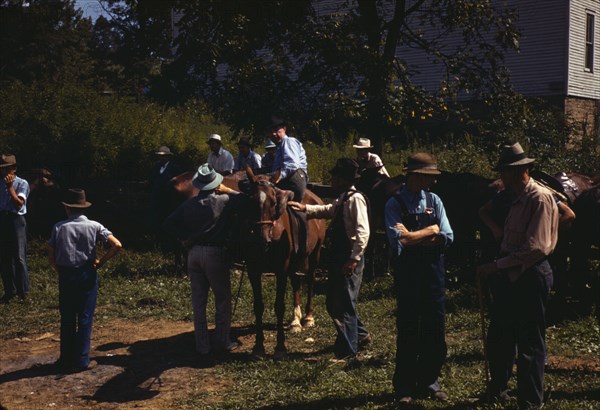 Mountaineers and farmers trading mules and horses on "Jockey St.,", Campton, Wolfe County, Ky., 1940 Creator: Marion Post Wolcott.