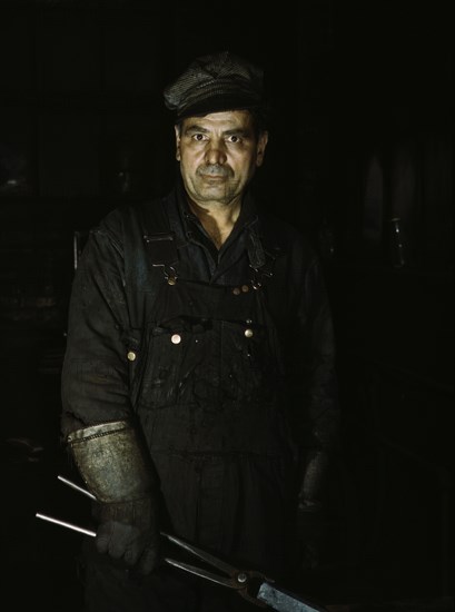 Daniel Anastazia, blacksmith's helper...roundhouse of the Rock Island R.R., Blue Island, Ill., 1943. Creator: Jack Delano.