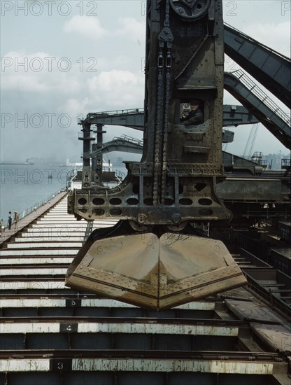 Pennsylvania R.R. ore docks, unloading iron ore from a lake freighter..., Cleveland, Ohio, 1943. Creator: Jack Delano.