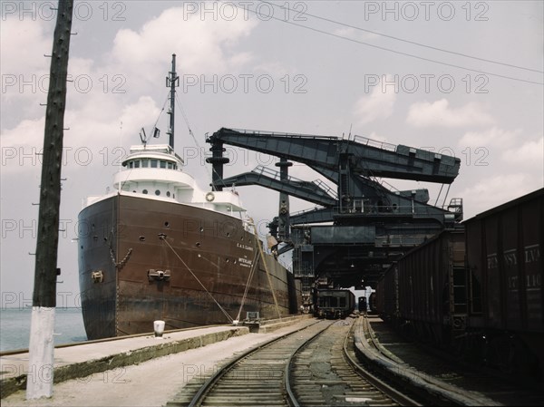 Pennsylvania R.R. ore docks, unloading iron ore from a lake freighter..., Cleveland, Ohio, 1943. Creator: Jack Delano.