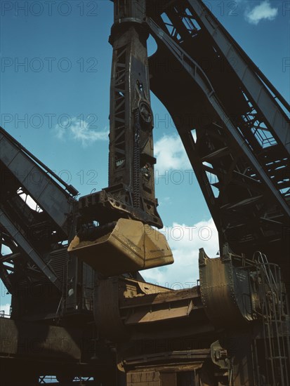 Pennsylvania R.R. ore docks, a "Hulett" ore unloader in operation, Cleveland, Ohio, 1943. Creator: Jack Delano.