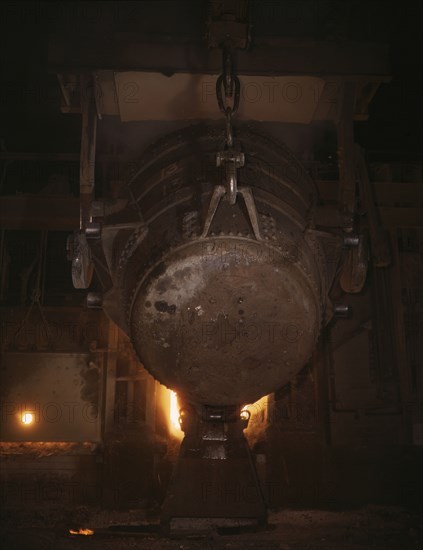 Ladle of molten iron is poured into..., Allegheny Ludlum Steele Corp., Brackenridge, Pa., (1941?). Creator: Alfred T Palmer.