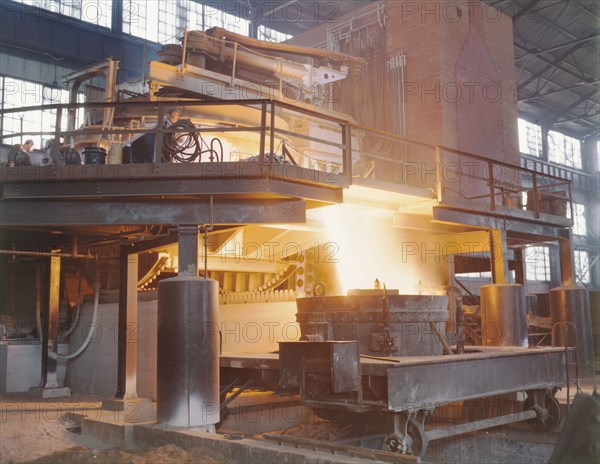 White-hot steel pours like water from a 35-ton electric furnace, Allegheny Ludlum Steele..., (1941?) Creator: Alfred T Palmer.