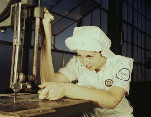 Women in white doctor Navy planes (motors) at the Naval Air Base, Corpus Christi, Texas, 1942. Creator: Howard Hollem.