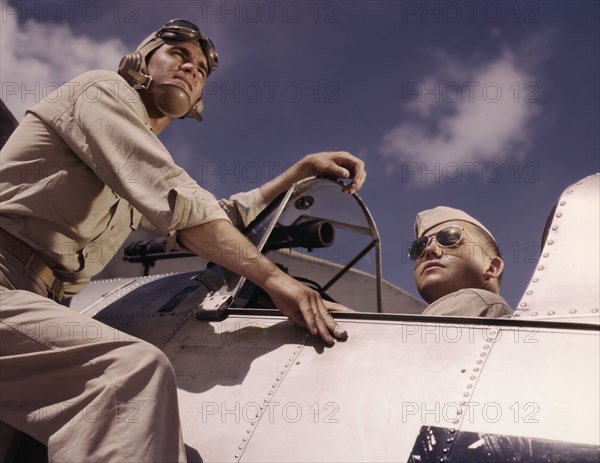 Ens[ign] Noressey and Cadet Thenics at the Naval Air Base, Corpus Christi, Texas, 1942. Creator: Howard Hollem.