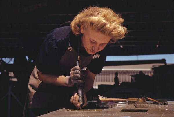 Working in the Assembly and Repair Dept. of the Naval Air Base, Corpus Christi, Texas, 1942. Creator: Howard Hollem.