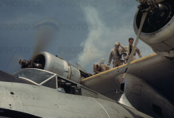 Starting a propeller at the Naval Air Base, Corpus Christi, Texas, 1942. Creator: Howard Hollem.