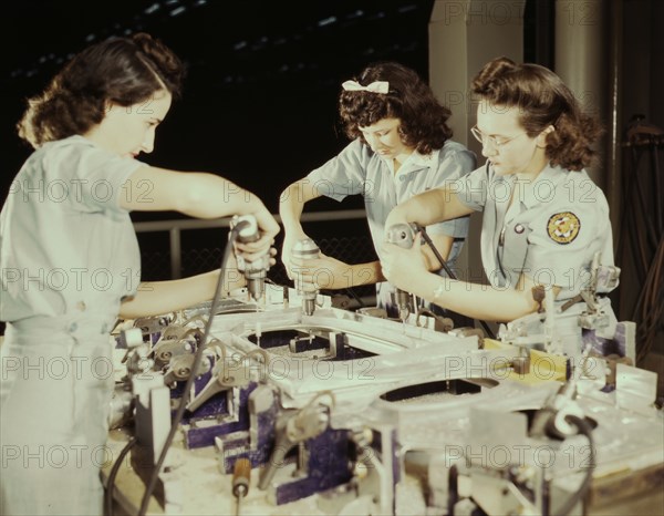 Drilling a wing bulkhead for a transport plane at the Consolidated Air..., Fort Worth, Texas, 1942. Creator: Howard Hollem.