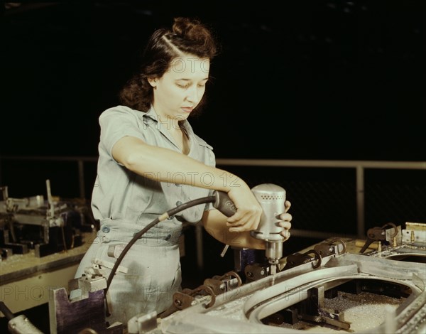 Drilling a wing bulkhead for a transport plane at the Consolidated Air..., Fort Worth, Texas, 1942. Creator: Howard Hollem.