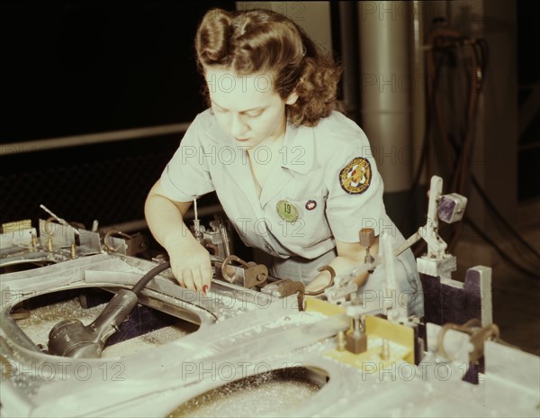 Drilling a wing bulkhead for a transport plane at the Consolidated Air..., Fort Worth, Texas, 1942. Creator: Howard Hollem.