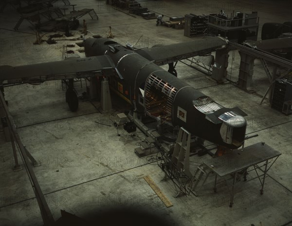 A mating operation on a transport plane...Consolidated Aircraft Corp..., Fort Worth, Texas, 1942. Creator: Howard Hollem.