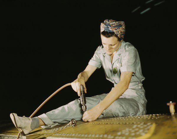 Drilling on a Liberator Bomber, Consolidated Aircraft Corp., Fort Worth, Texas, 1942. Creator: Howard Hollem.