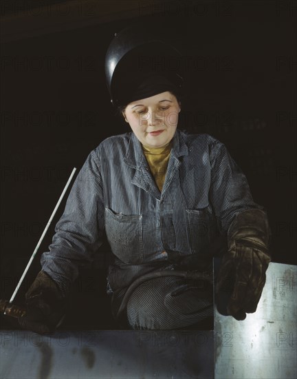 Enola O'Connell, age 32, widow and mother of one child...Heil and Co., Milwaukee, Wisconsin, 1943. Creator: Howard Hollem.