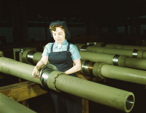 Gist inspector, Mrs. Mary Betchner inspecting one of the 25 cutters..., Milwaukee, Wis. , 1943. Creator: Howard Hollem.