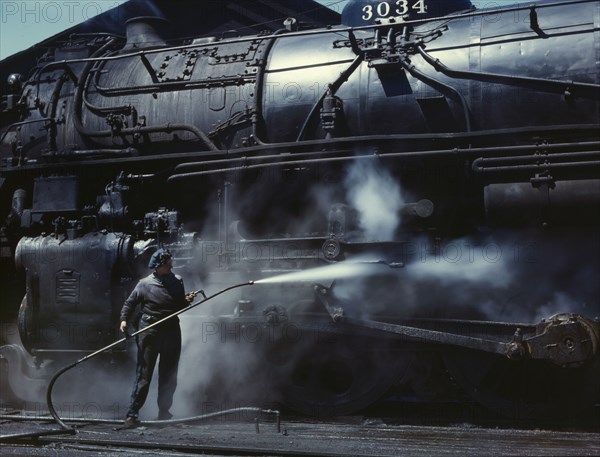 Mrs. Viola Sievers, one of the wipers at the roundhouse giving a giant "H"..., Clinton, Iowa, 1943. Creator: Jack Delano.