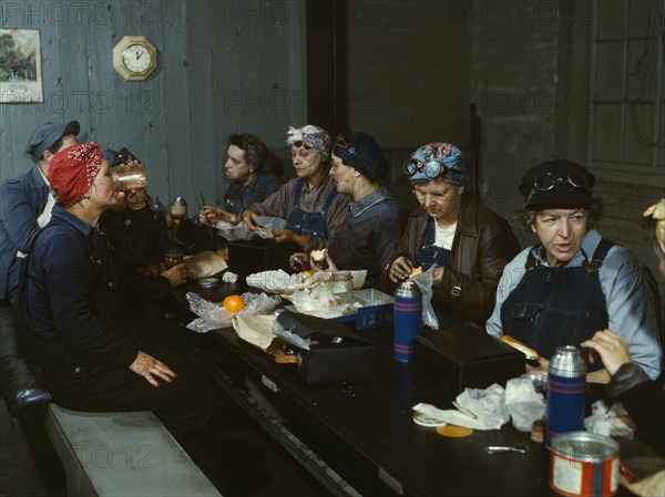 Women workers employed as wipers in the roundhouse having lunch..., C&NWRR., Clinton, Iowa, 1943. Creator: Jack Delano.