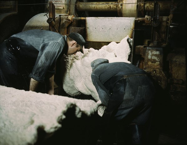 This sheet of synthetic rubber coming off the rolling mill...B.F. Goodrich Co., Akron, Ohio, 1941. Creator: Alfred T Palmer.