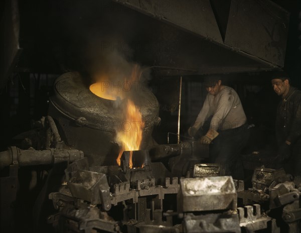 Casting a billet from an electric furnace, Chase Brass and Copper Co., Euclid, Ohio, 1942. Creator: Alfred T Palmer.