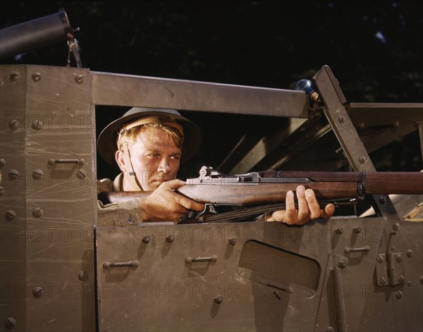 Halftrack infantryman with Garand rifle, Ft. Knox, Ky., 1942. Creator: Alfred T Palmer.