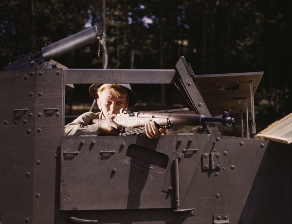 Halftrack infantryman with Garand rifle, Ft. Knox, Ky., 1942. Creator: Alfred T Palmer.