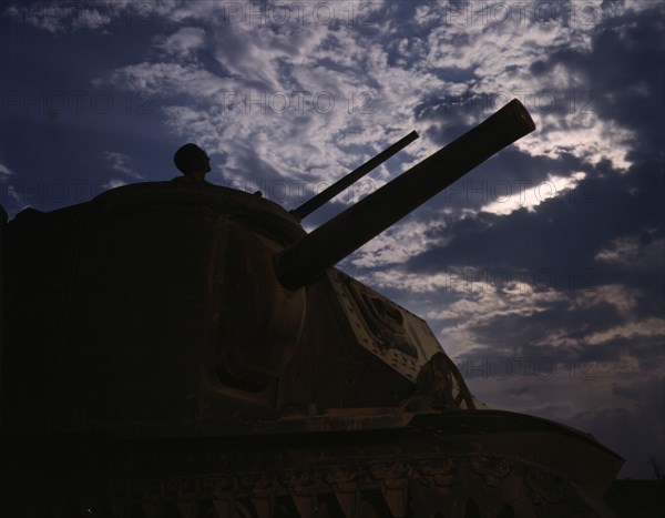 The crew of an M-3 tank learn all the ways of causing trouble for the Axis...Fort Knox, Ky, 1942. Creator: Alfred T Palmer.