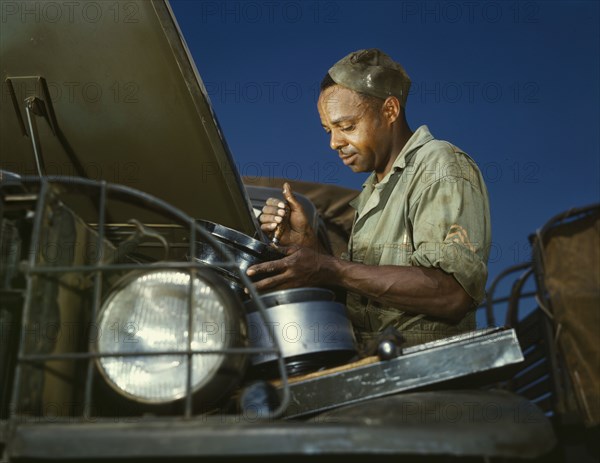 A good job in the air cleaner of an army truck, Fort Knox, Ky., 1942. Creator: Alfred T Palmer.