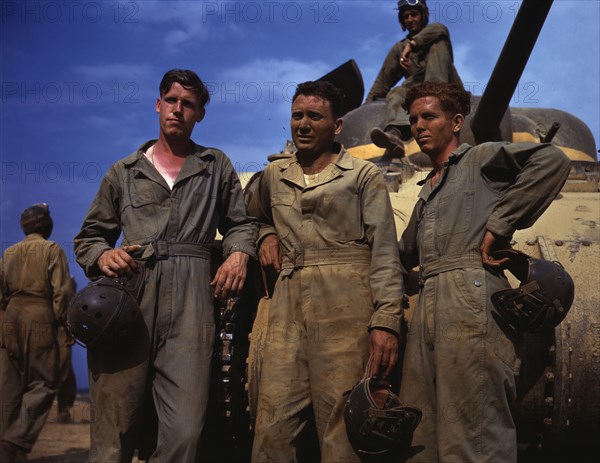 Tank crew standing in front of M-4 tank, Ft. Knox, Ky., 1942. Creator: Alfred T Palmer.