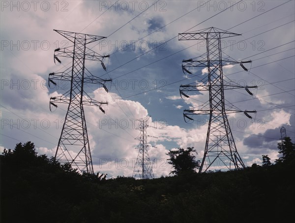 Transmission line towers and high tension lines that......Wilson Dam..., near Sheffield, Ala., 1942. Creator: Alfred T Palmer.