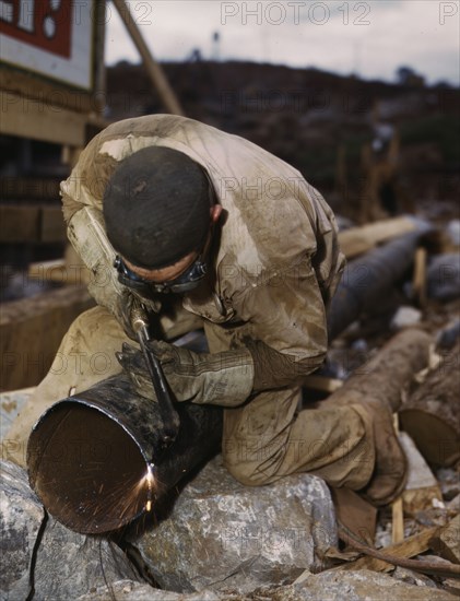 Welder at work on Douglas Dam, Tenn. (TVA), 1942. Creator: Alfred T Palmer.