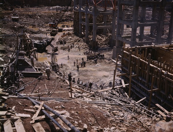 Excavating within the log cofferdam during an early stage of construction, Douglas Dam, Tenn., 1942. Creator: Alfred T Palmer.