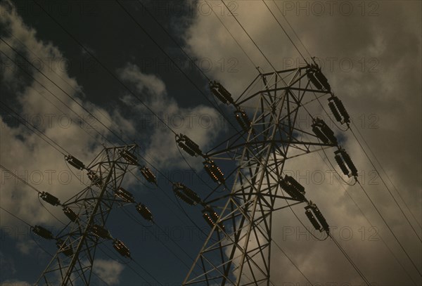 Insulators and transmission wires in the switchyard of the TVA's Chickamauga Dam..., Tennessee, 1942 Creator: Alfred T Palmer.